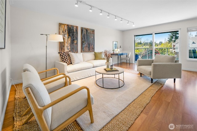 2501 Canterbury Ln E Unit 221, Seattle, WA 98112 - living area featuring track lighting and wood finished floors