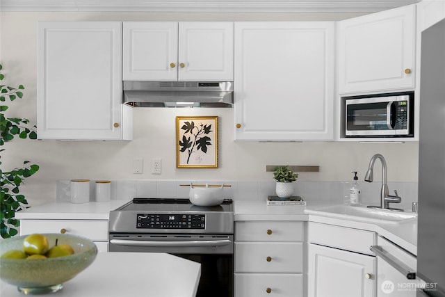 2501 Canterbury Ln E Unit 221, Seattle, WA 98112 - kitchen with appliances with stainless steel finishes, under cabinet range hood, white cabinetry, and light countertops
