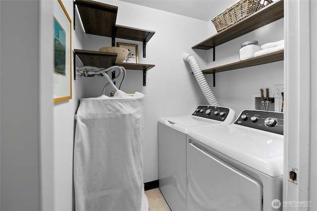 2501 Canterbury Ln E Unit 221, Seattle, WA 98112 - laundry room featuring washing machine and dryer and light tile patterned floors