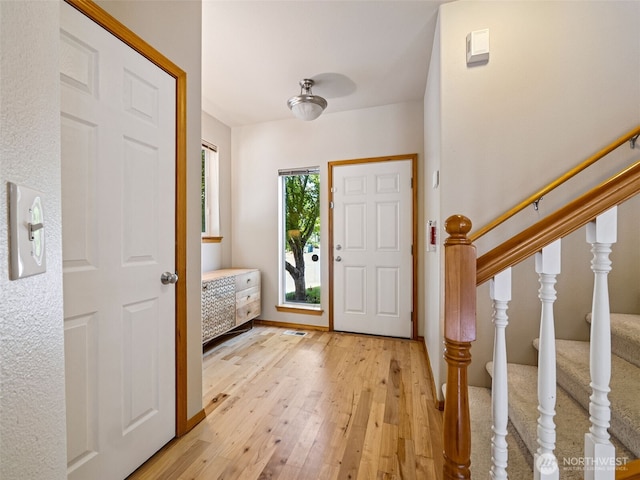11403 SE 171st St, Renton, WA 98055 - foyer entrance featuring light wood finished floors and stairway
