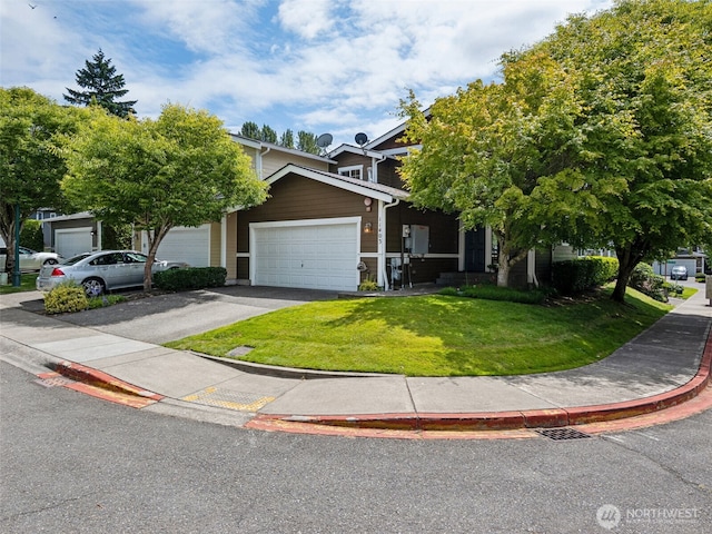 11403 SE 171st St, Renton, WA 98055 - view of property hidden behind natural elements featuring a front lawn, an attached garage, and driveway