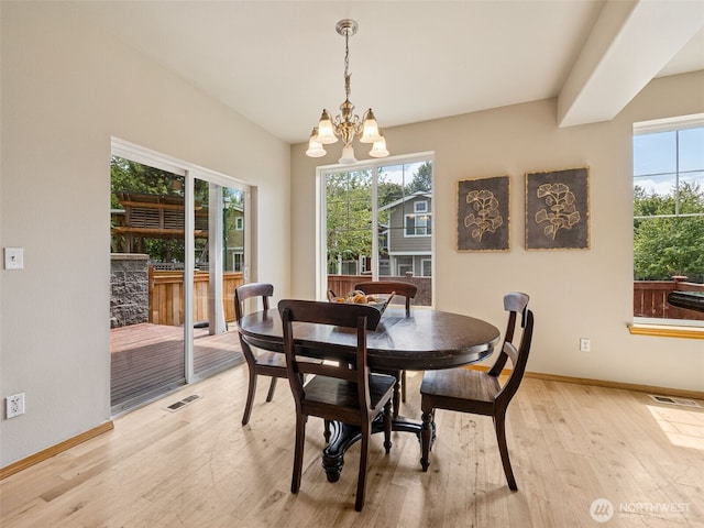 11403 SE 171st St, Renton, WA 98055 - dining space featuring light wood-style flooring and a chandelier
