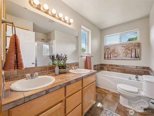 11403 SE 171st St, Renton, WA 98055 - full bathroom with a garden tub, double vanity, a shower with shower door, and tile patterned flooring