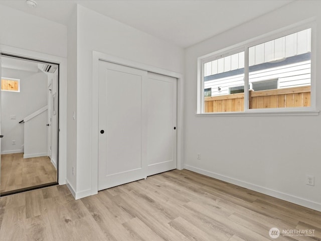 9015 Dibble Ave NW Unit B, Seattle, WA 98117 - unfurnished bedroom with light wood-style flooring and a closet