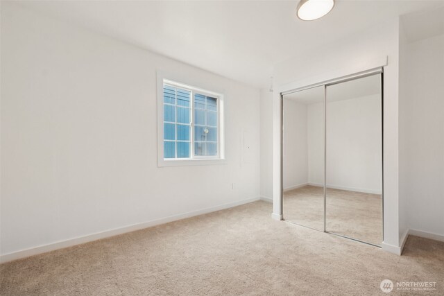 24405 24th Ave S, Des Moines, WA 98198 - unfurnished bedroom featuring carpet floors and a closet