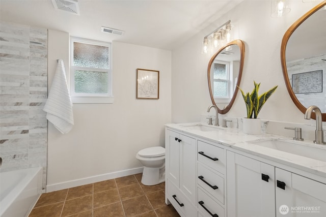 24405 24th Ave S, Des Moines, WA 98198 - full bath featuring double vanity, tile patterned flooring, and bathtub / shower combination
