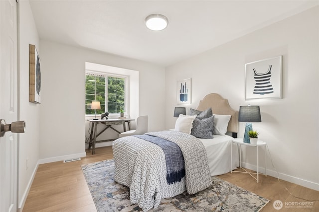 24405 24th Ave S, Des Moines, WA 98198 - bedroom featuring light wood finished floors and baseboards