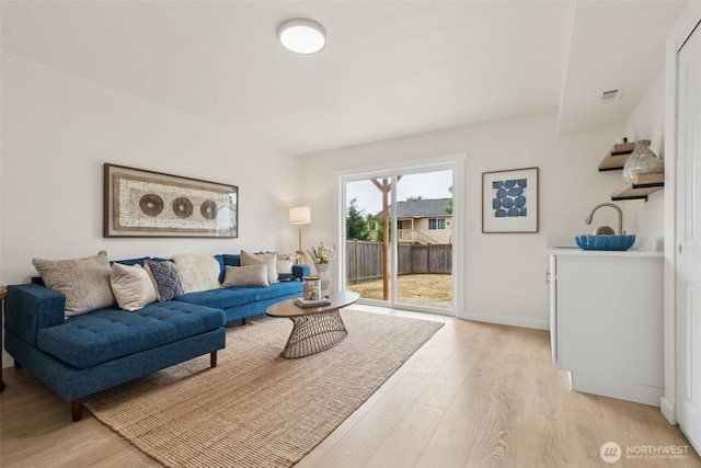 24405 24th Ave S, Des Moines, WA 98198 - living room featuring light wood finished floors and baseboards