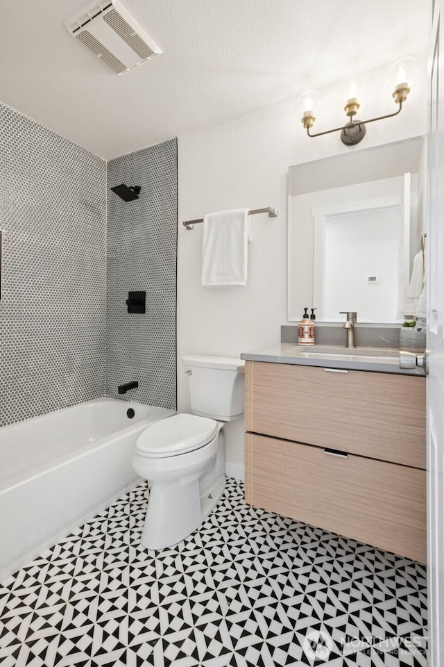 24405 24th Ave S, Des Moines, WA 98198 - full bathroom featuring tile patterned floors, vanity, and shower / washtub combination