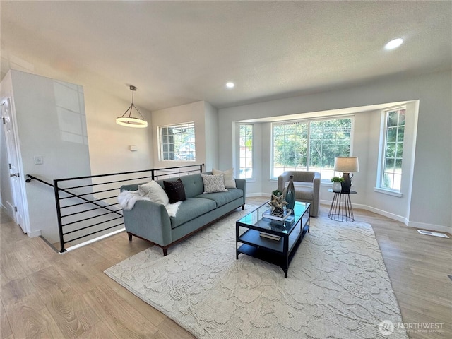 24405 24th Ave S, Des Moines, WA 98198 - living room with wood finished floors, plenty of natural light, and recessed lighting