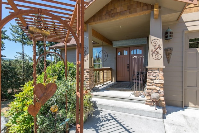 822 E Oak St, Sequim, WA 98382 - doorway to property featuring covered porch, a pergola, and a garage