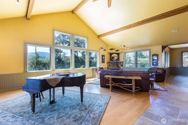 822 E Oak St, Sequim, WA 98382 - living area featuring beamed ceiling, high vaulted ceiling, light wood-style flooring, wainscoting, and ceiling fan
