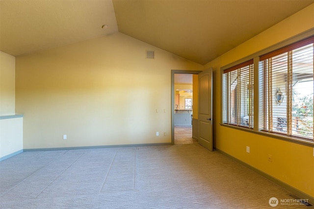 822 E Oak St, Sequim, WA 98382 - empty room with vaulted ceiling, plenty of natural light, and light carpet
