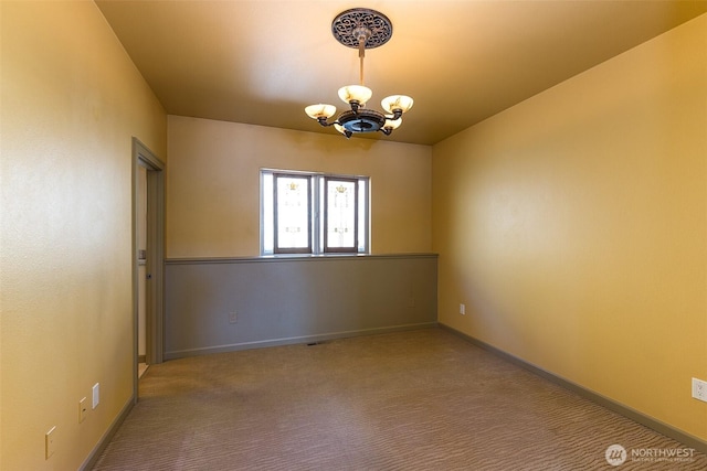 822 E Oak St, Sequim, WA 98382 - carpeted spare room with a chandelier and baseboards