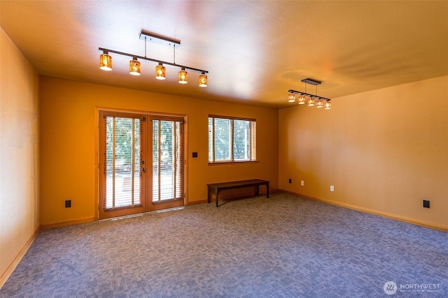 822 E Oak St, Sequim, WA 98382 - spare room with french doors, track lighting, plenty of natural light, and carpet
