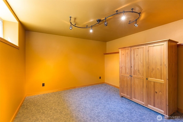 822 E Oak St, Sequim, WA 98382 - unfurnished bedroom with carpet floors and track lighting