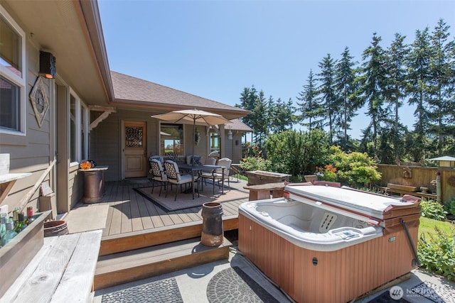 822 E Oak St, Sequim, WA 98382 - wooden terrace featuring a hot tub and outdoor dining space