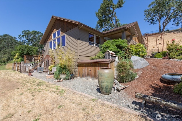 822 E Oak St, Sequim, WA 98382 - view of side of home featuring stairs