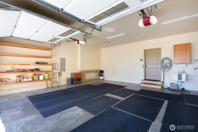 822 E Oak St, Sequim, WA 98382 - garage with a garage door opener and electric panel