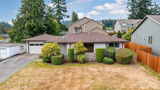 1411 38th St, Anacortes, WA 98221 - traditional home featuring concrete driveway, a garage, a residential view, and a shingled roof