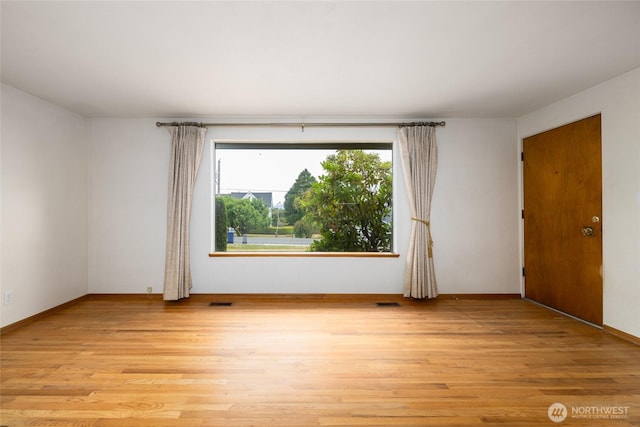 1411 38th St, Anacortes, WA 98221 - empty room with light wood-type flooring and baseboards