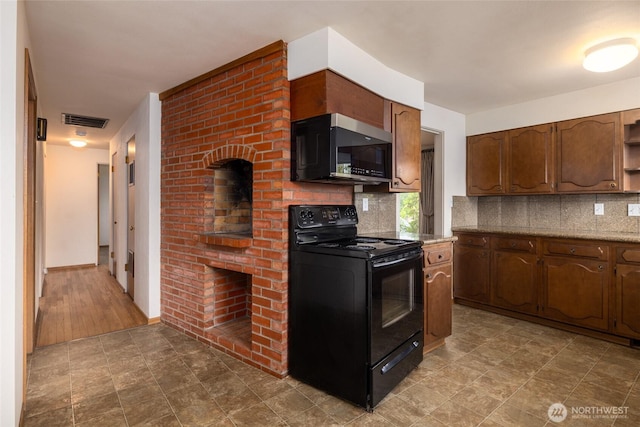 1411 38th St, Anacortes, WA 98221 - kitchen with black range with electric cooktop, tasteful backsplash, open shelves, and light countertops
