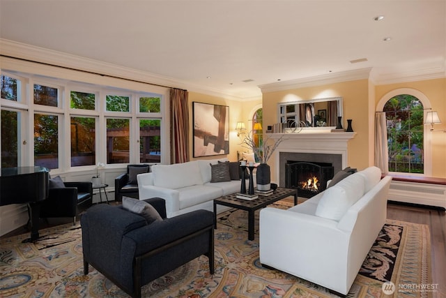 1617 Federal Ave E, Seattle, WA 98102 - living area with a lit fireplace, ornamental molding, plenty of natural light, wood finished floors, and recessed lighting