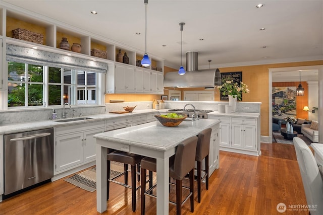 1617 Federal Ave E, Seattle, WA 98102 - kitchen with dishwasher, island exhaust hood, a kitchen breakfast bar, white cabinets, and ornamental molding