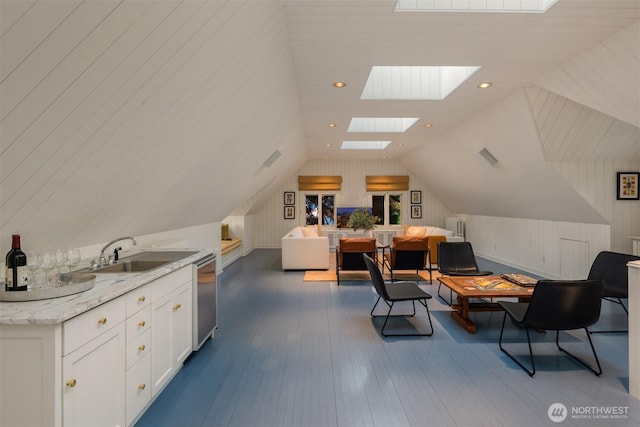 1617 Federal Ave E, Seattle, WA 98102 - office with a skylight, vaulted ceiling, dark wood-style floors, and recessed lighting