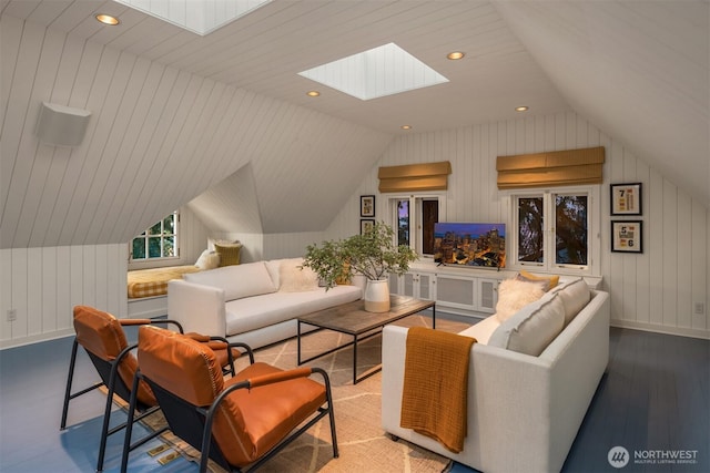 1617 Federal Ave E, Seattle, WA 98102 - living area with a skylight, lofted ceiling, wood finished floors, recessed lighting, and wooden walls