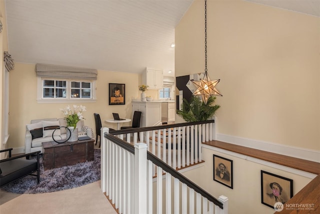 1617 Federal Ave E, Seattle, WA 98102 - hallway featuring an upstairs landing, lofted ceiling, and carpet