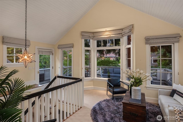 1617 Federal Ave E, Seattle, WA 98102 - sitting room featuring vaulted ceiling, a chandelier, and carpet