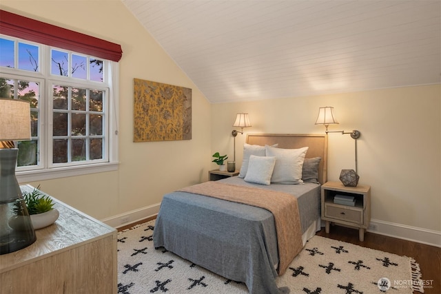 1617 Federal Ave E, Seattle, WA 98102 - bedroom featuring lofted ceiling, wood finished floors, and multiple windows