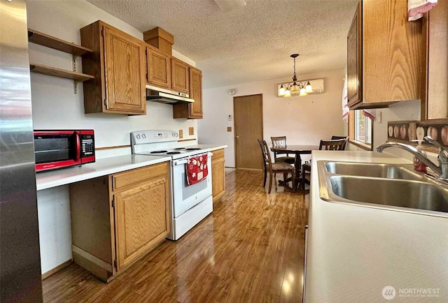 798 Division Ave, Morton, WA 98356 - kitchen featuring white electric stove, under cabinet range hood, wood finished floors, a chandelier, and open shelves