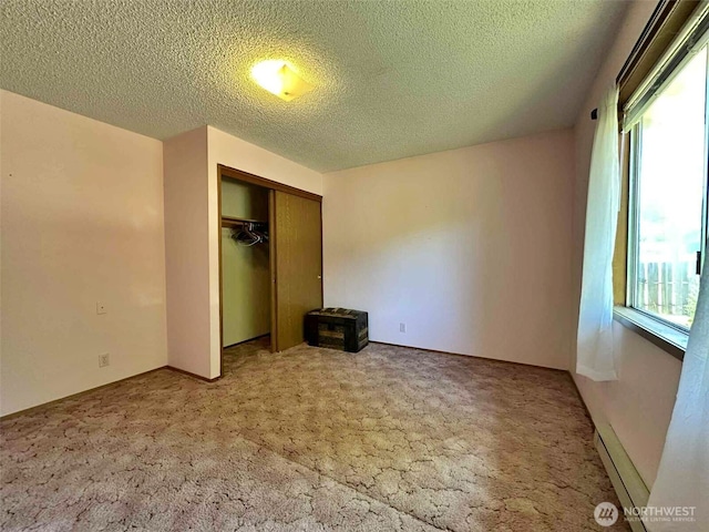 798 Division Ave, Morton, WA 98356 - unfurnished bedroom featuring light carpet, a closet, and a textured ceiling