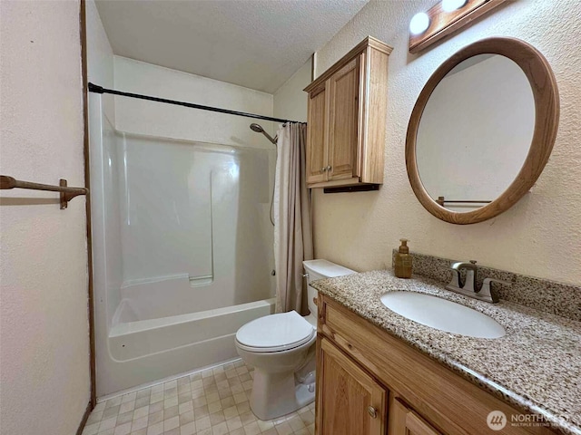 798 Division Ave, Morton, WA 98356 - bathroom with vanity, shower / bath combo with shower curtain, a textured wall, tile patterned floors, and a textured ceiling