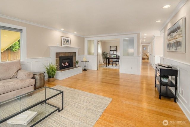 108 151st Pl SE, Lynnwood, WA 98087 - living room with a decorative wall, crown molding, light wood-type flooring, a fireplace, and recessed lighting