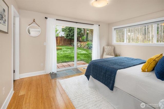 108 151st Pl SE, Lynnwood, WA 98087 - bedroom with access to outside, multiple windows, and light wood-style flooring