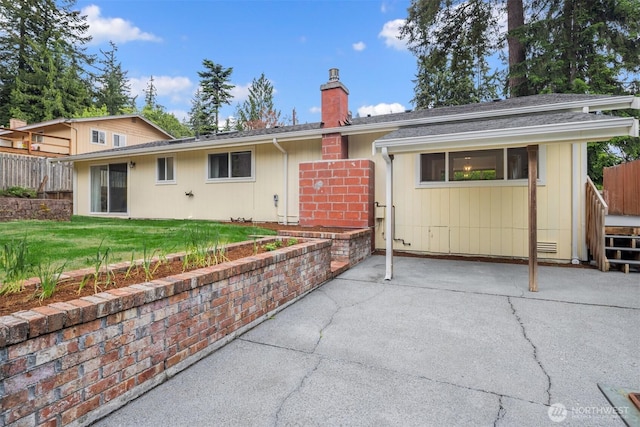 108 151st Pl SE, Lynnwood, WA 98087 - back of house with a patio area and a chimney