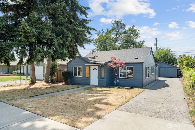 6416 S Huson St, Tacoma, WA 98409 - ranch-style home with roof with shingles, a garage, and an outdoor structure
