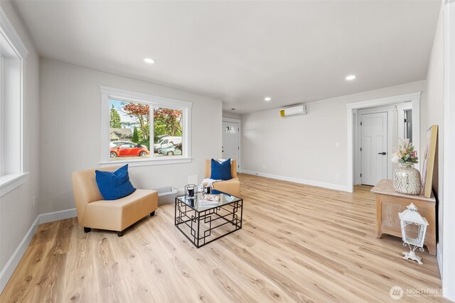 6416 S Huson St, Tacoma, WA 98409 - sitting room featuring an AC wall unit, light wood-style floors, and recessed lighting