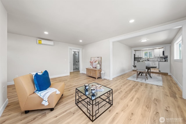 6416 S Huson St, Tacoma, WA 98409 - living area featuring light wood-style flooring, a wall mounted AC, and recessed lighting