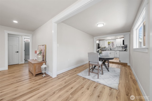 6416 S Huson St, Tacoma, WA 98409 - dining room with light wood finished floors and baseboards