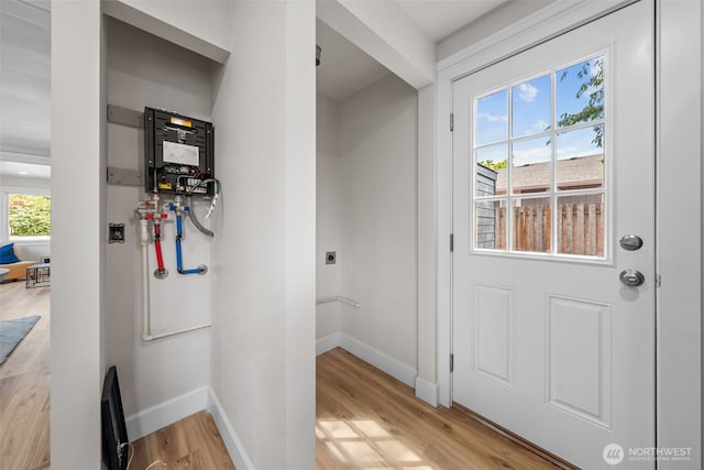 6416 S Huson St, Tacoma, WA 98409 - doorway to outside featuring light wood-style floors and baseboards