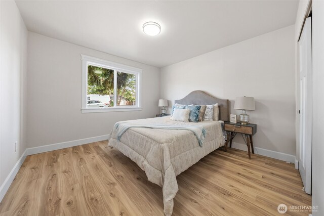 6416 S Huson St, Tacoma, WA 98409 - bedroom with light wood-style flooring and baseboards