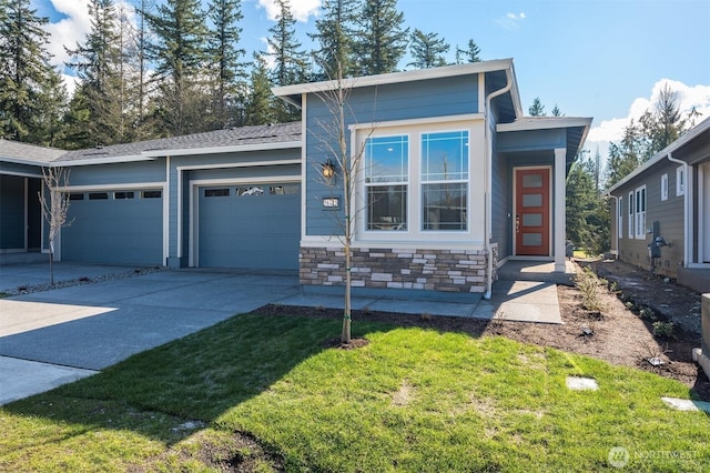 21725 SE 292 Nd Pl, Black Diamond, WA 98010 - view of front facade with an attached garage, driveway, a front yard, and stone siding