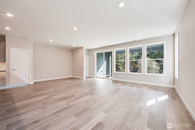 21725 SE 292 Nd Pl, Black Diamond, WA 98010 - spare room featuring light wood-style flooring, recessed lighting, and stairs