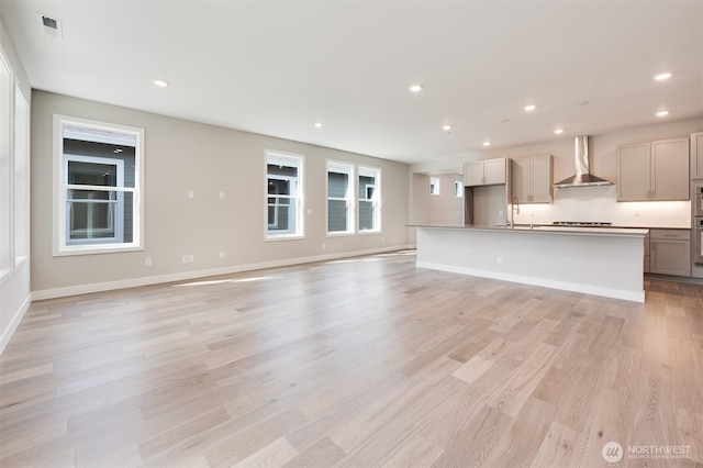 21725 SE 292 Nd Pl, Black Diamond, WA 98010 - unfurnished living room featuring light wood-type flooring and recessed lighting