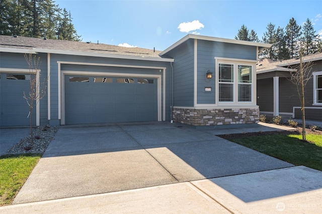 21725 SE 292 Nd Pl, Black Diamond, WA 98010 - view of front facade featuring driveway, stone siding, and a garage