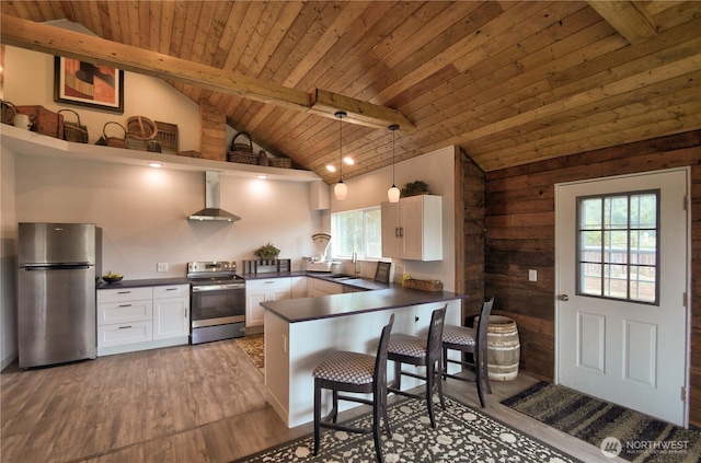 53 E Elma Mccleary Rd, Elma, WA 98514 - kitchen featuring stainless steel appliances, open shelves, dark countertops, wall chimney exhaust hood, and a wood ceiling with exposed beams